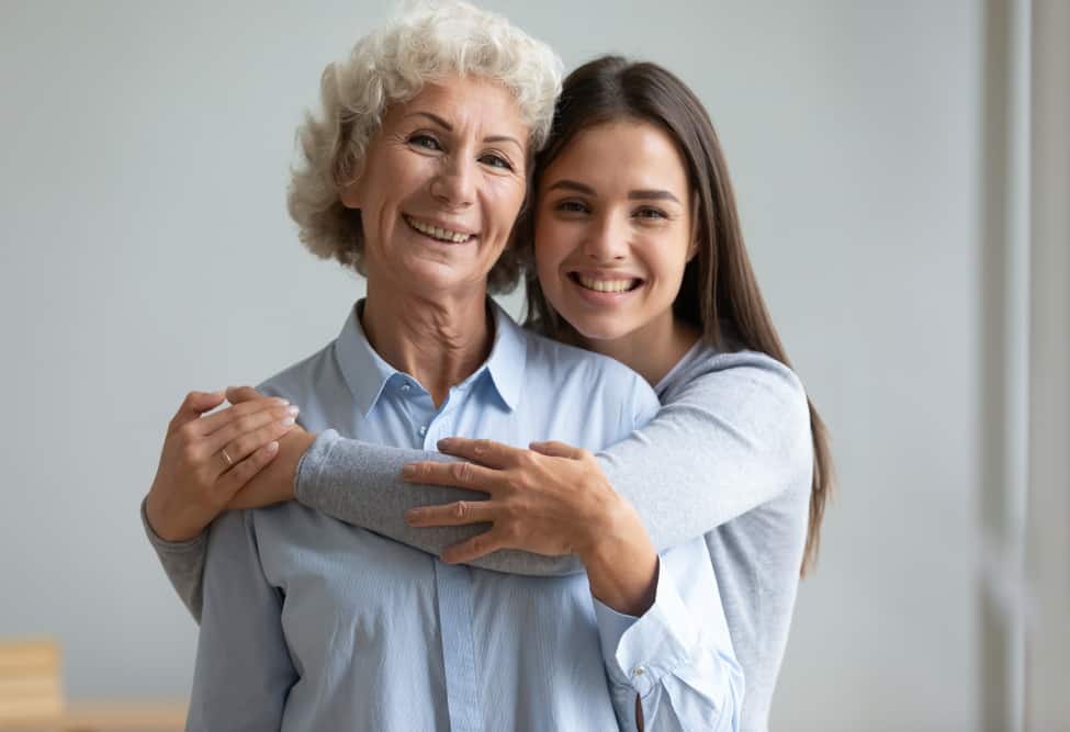 Beautiful,Adult,Daughter,Hug,Older,Mother,At,Home,,Senior,Lady